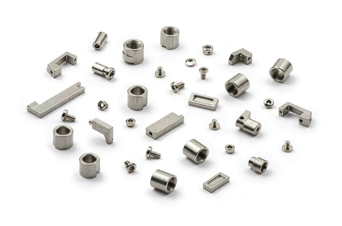 Sintered stainless steel eyewear hinge barrels, screws and mounting plates